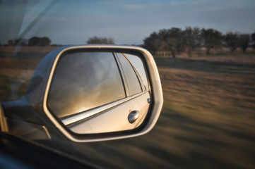 Roadtrip through Argentina, sunset in the car mirror