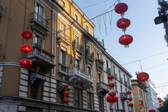 Old houses and red lanterns along via Sarpi in Milan