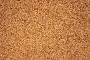 Texture orange pebble dash stucco facade