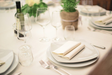 Italian table setting at a luxury wedding or another catered event. Wedding rustic style. Wedding table decoration.
