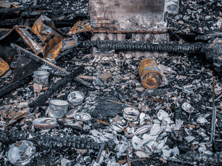 burned down house, remnants of burned down, destroyed house, dishes and garbage after a fire