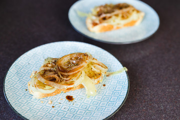 plant-based food, vegan roasted onion bruschetta on homemade damper bread