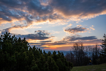 sunrise in the mountains with forest in the foreground with beautiful sky, czech republic beskydy Javorovy vrch