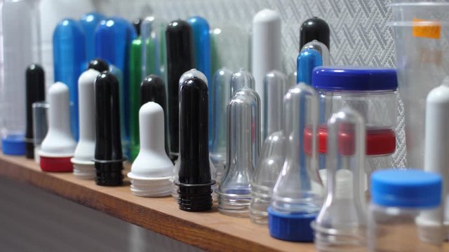 Sample of Plastic Bottle Part from PET Preform Injection Molding Machine on Shelves, Polyethylene Terephthalate