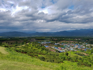 Dark grey rain forest dark clouds fog background mountains green nature outside pai up yun lai temple viewpoint thailand