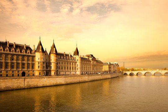 The Conciergerie at Justice Palace and Pont Neuf Bridge over the Seine River, Ile de la Cite, Paris, France