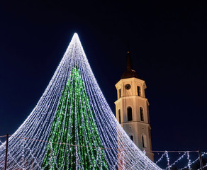 Christmas tree and Cathedral bell tower in Vilnius Lithuania