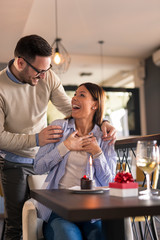 Couple celebrating birthday in restaurant