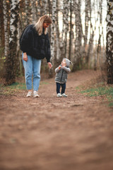 Mother and son walk in the spring Park