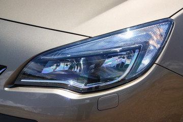 Fototapeta na wymiar Shiny car headlight