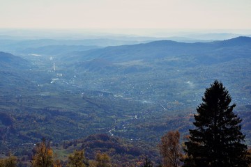 scene seen from above in autumn season from the top of mountain with colored and vibrant trees
