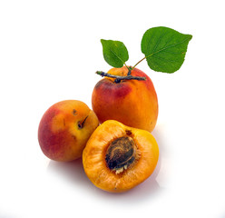 Naklejka na ściany i meble Isolated apricot. Fresh cut apricot fruits isolated on white background