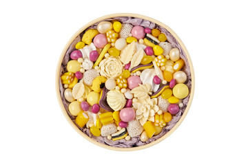 Fototapeta na wymiar Yellow round box filled with handmade white chocolate candies isolated on white background