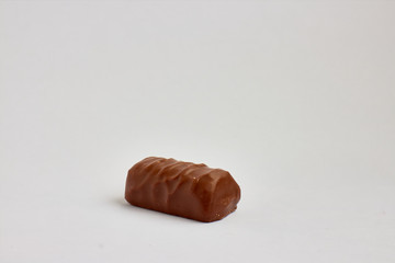 small chocolate bar on white background