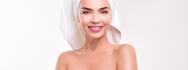 Beautiful young woman  perfect skin. Healthy woman in towel with perfect skin