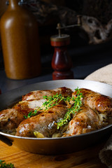 Homemade white sausage fried with onion and herbs