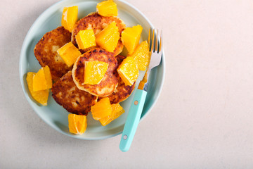 Cottage cheese fritters with oranges