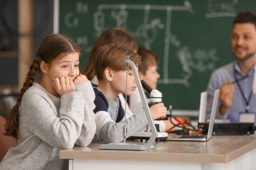 Pupils at physics lesson in classroom