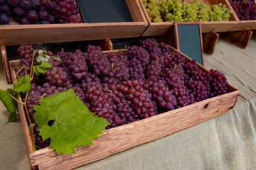 Box of red grapes on a market stall. Picture taken in a food market near Shibuya district in Tokyo, Japan.