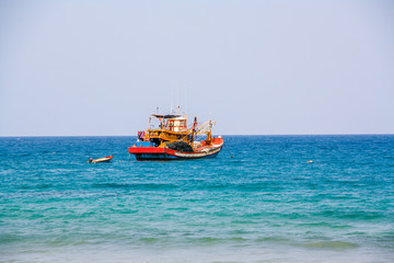 Fototapeta premium Old fishing boat in Cambodia with blue sky