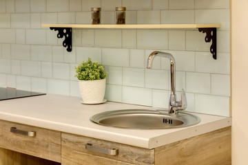 a kitchen interior with drawers