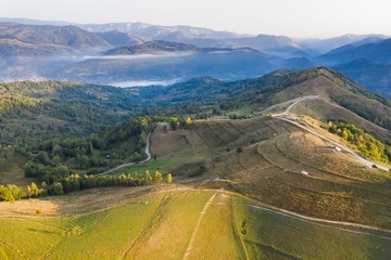 Drone view of beautiful summer sunrise over Transylvanian mountains.