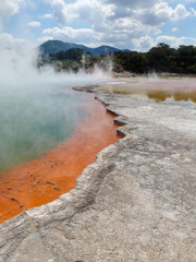An orange blue volcanic hot spot in Rotorua, New Zealand