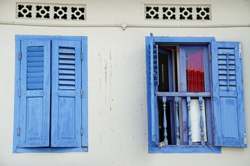 colorful wooden window shutters in singapore