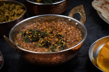 Indian lentil and spice dish in traditional bowl