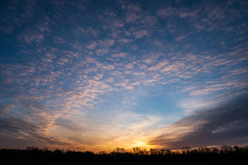sunrise with beautiful sky and silhouette of forest