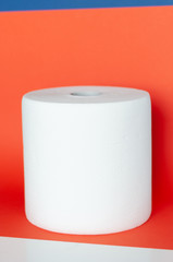 roll with paper towels on a colored background