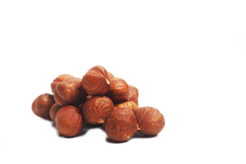 Obraz premium A pile of hazelnut isolated on white background. Image contains copy space