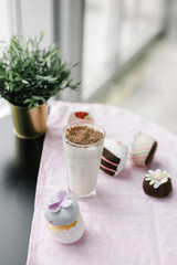banana milkshake with chocolate chips and plush cakes