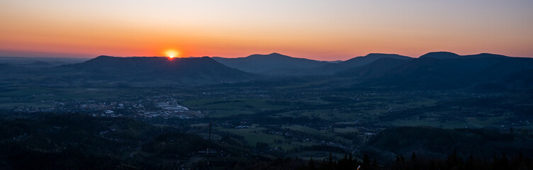 sunrise over the mountains with a silhouette of the landscape