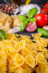 concept of traditional italian pasta with tomatoes and basil