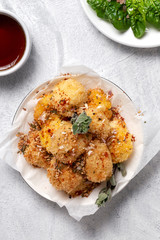 Fried small cheese mozzarella balls breaded in panko