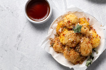 Fried small cheese mozzarella balls breaded in panko