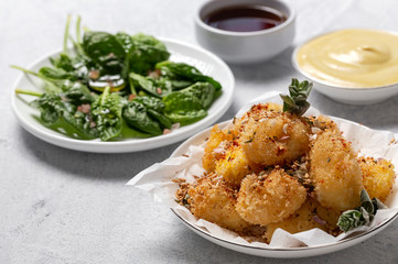Fried small cheese mozzarella balls breaded in panko