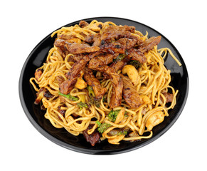 Beef in black bean sauce with egg noodles and cashew nuts meal isolated on a white background