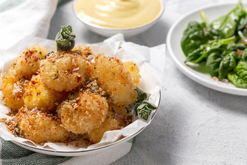 Fried small cheese mozzarella balls breaded in panko