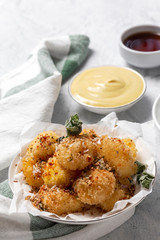 Fried small cheese mozzarella balls breaded in panko