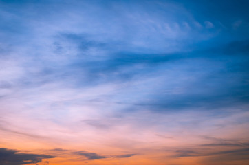 Sunset in the clouds in the form of tracks Sunset light Clouds in the form of long orange stripes in the sky