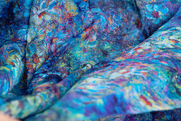 Fabric natural silkworm silk, Chinese silk, bright blue-blue colors. Print wild flowers. Translucent. Texture, background, close-up, Wallpaper. The waves.