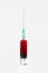 Blood test syringe isolated on white, closeup