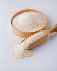 natural organic semolina on white acrylic background