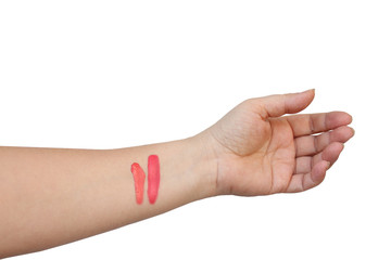 lipstick two abstract strokes on a female hand of pink, natural color, sample color makeup sample, concept natural cosmetics
