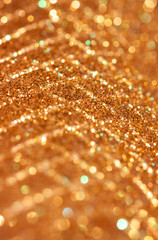Sparkly gold abstract pattern with out of focus circles and highlights