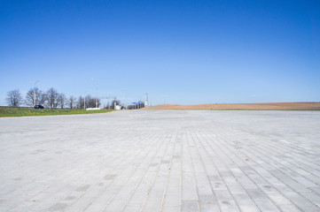 Empty asphalt parking in summer in a southern country