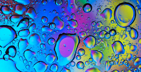 A happy colorful background filled by water drops. - obrazy, fototapety, plakaty