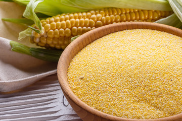 Polenta corn porridge on white wooden rustic background